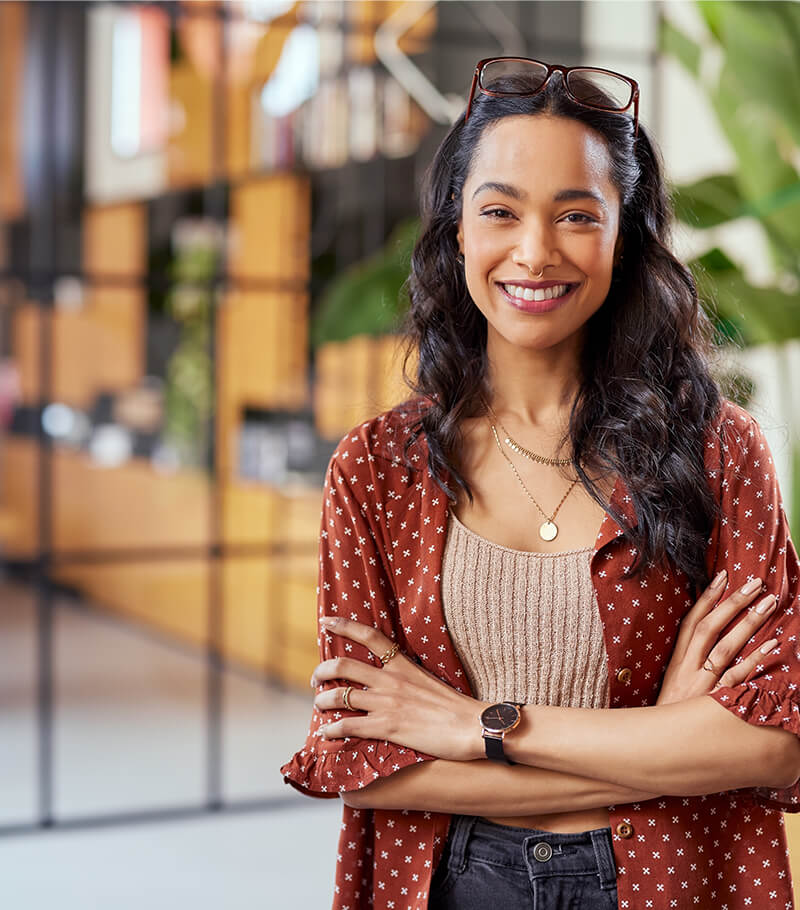 portrait,of,smiling,young,multiethnic,woman,looking,at,camera,with
